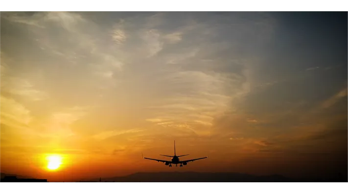 An aircraft arriving at Antalya at sunset
